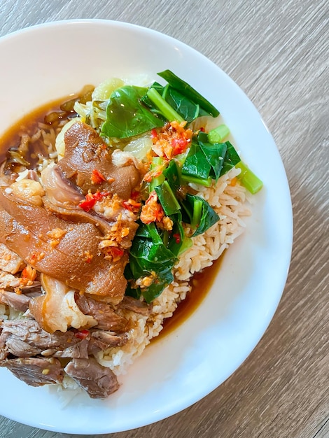 Baised pork leg with steamed rice ready to eat