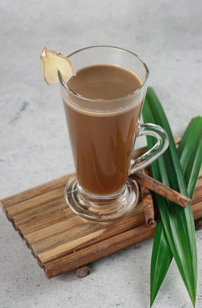 Bajigur Javanese traditional hot drink of herbal coffee latte with coconut milk and ginger