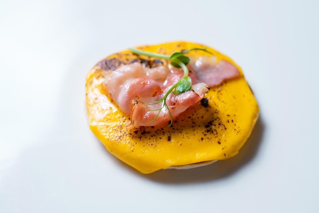 Baked appetizer with ham cheese and herbs