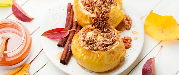 Baked apples stuffed with oatmeal and nuts.Copy space