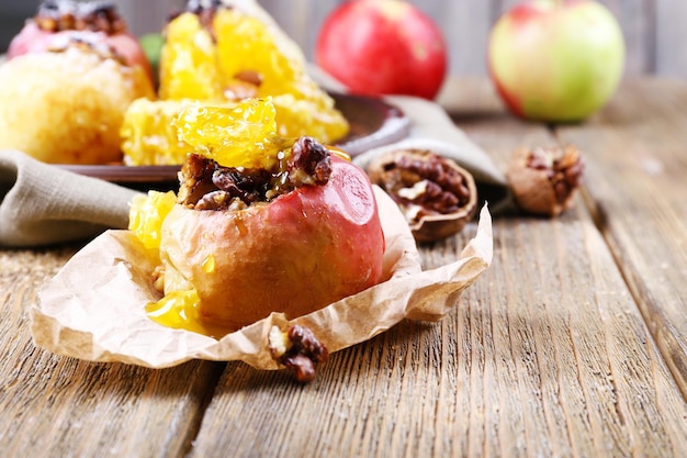 Baked apples on table close up