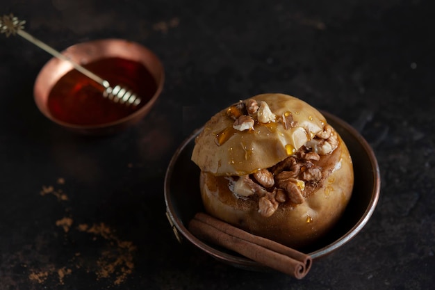 Baked apples with cinnamon stuffed with walnuts