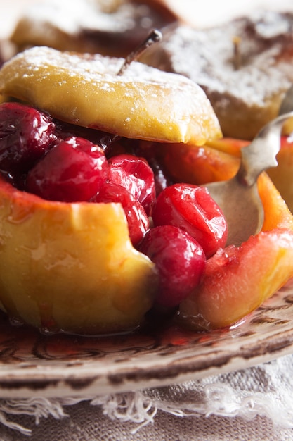 Baked apples with cranberries closeup