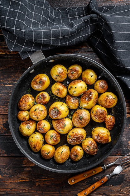 Baked baby potatoes in a cast iron skillet