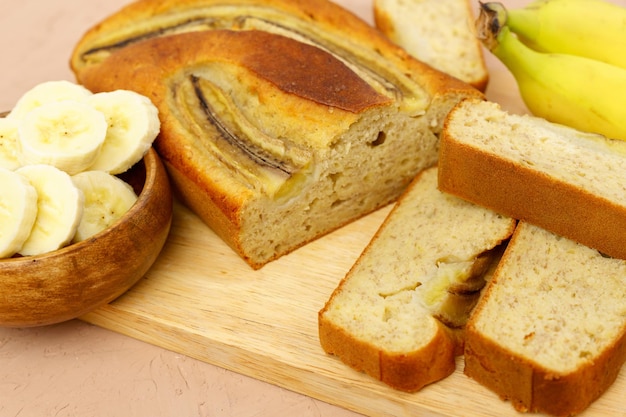 Baked banana bread sliced on a cutting board Bakery cafe home chef menu concept