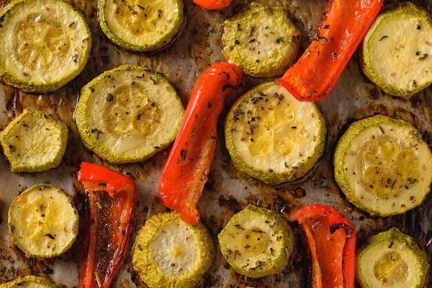 Baked bell peppers and zucchini close-up