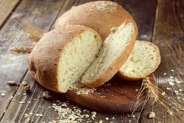 Baked bread on wooden table