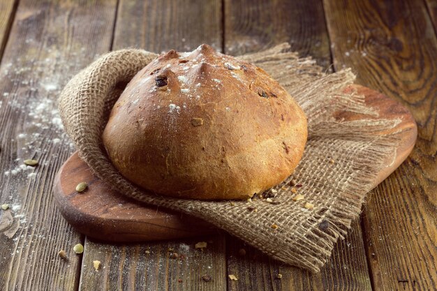 Baked bread on wooden table