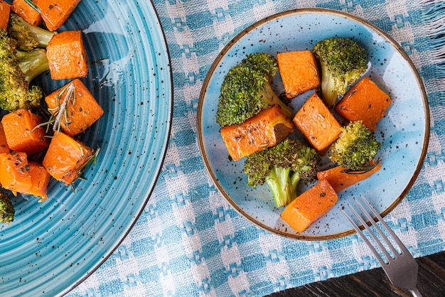 Baked broccoli and pumpkin. concept of healthy and delicious food.