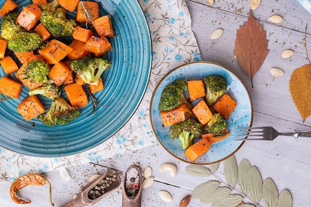 Baked broccoli and pumpkin. concept of healthy and delicious food.