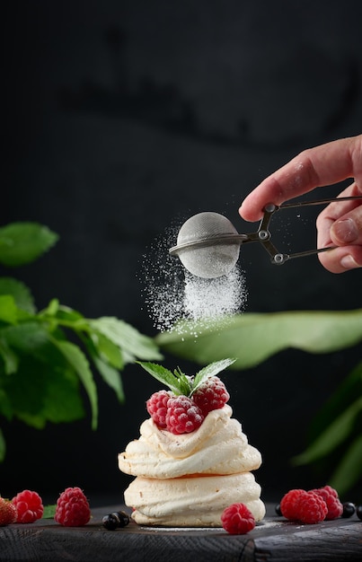 baked cake made from whipped chicken protein and cream decorated with fresh berrie