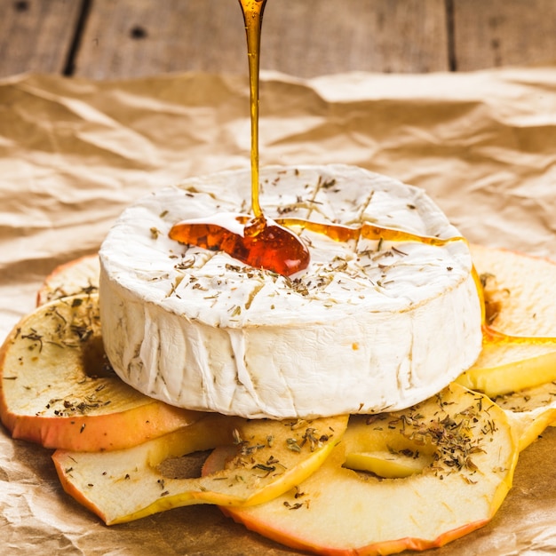 Baked camembert with apples dipped with honey
