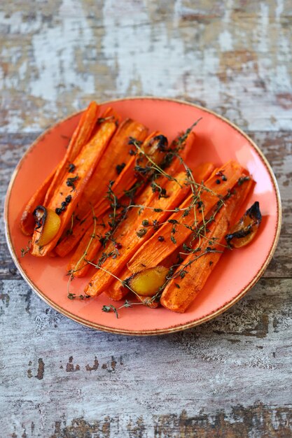 Baked carrots in strips with herbs and spices.