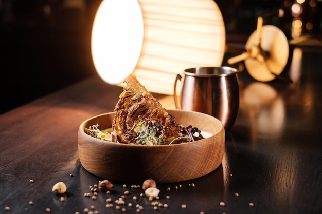 Baked cauliflower in sauce in wooden table