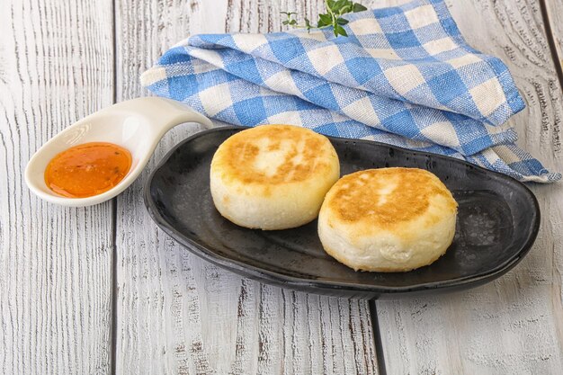 Baked cheesecakes syrniki with fruit jam