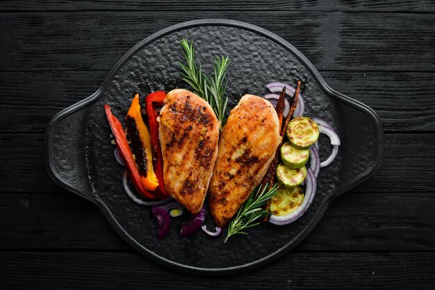 Baked chicken breast with spices and rosemary Top view BBQ