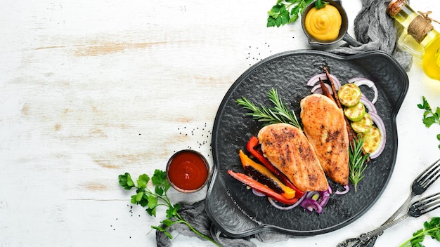 Baked chicken breast with spices and rosemary Top view BBQ