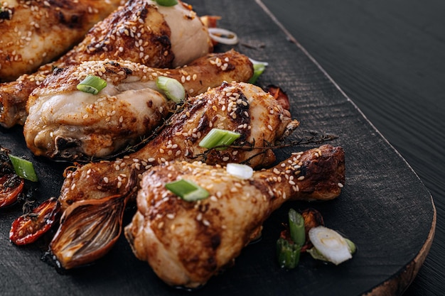 Baked chicken drumsticks with sesame honey and soy sauce onion and spices