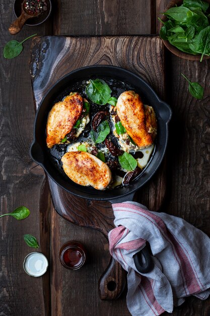 Baked Chicken fillet stuffed with cheese, spinach and sun-dried tomatoes