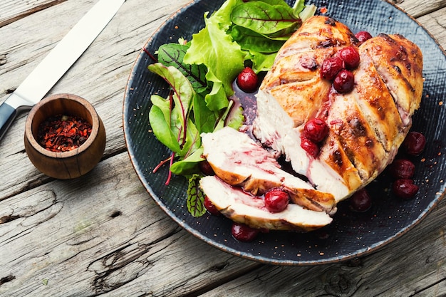 Baked chicken meat and cherry sauce for the meat.