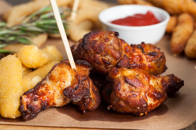 Baked chicken wings together with ketchup