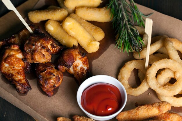 Baked chicken wings together with ketchup