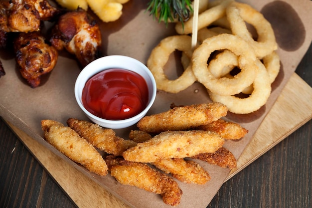 Baked chicken wings together with ketchup