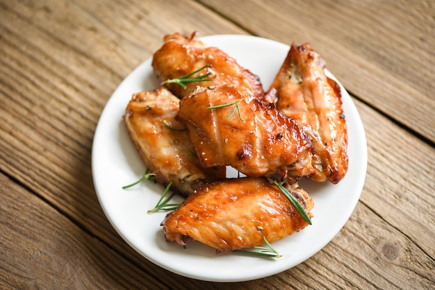 Baked chicken wings with sauce herbs and spices