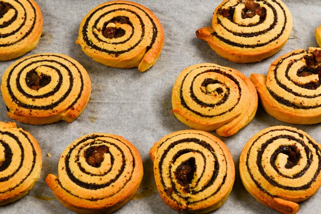 Baked cookies with raisins and poppy seeds on a trail