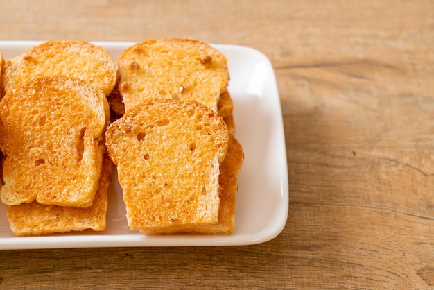 Baked crispy bread with butter and sugar