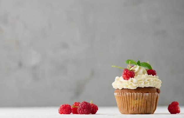 Baked cupcakes with white butter cream on the table delicious dessert