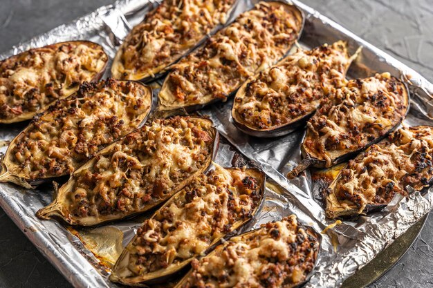 Baked delicious eggplant with meat on a baking sheet