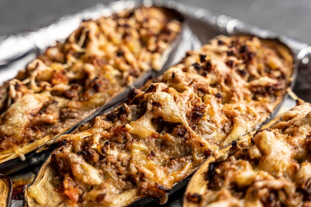 Baked delicious eggplant with meat on a baking sheet