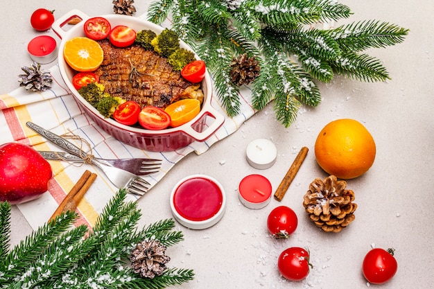 Photo baked duck breast with vegetables and sauce. christmas dinner concept, new year table setting.