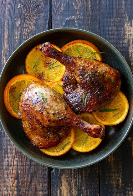 Baked duck legs with oranges and rosemary Rustic style