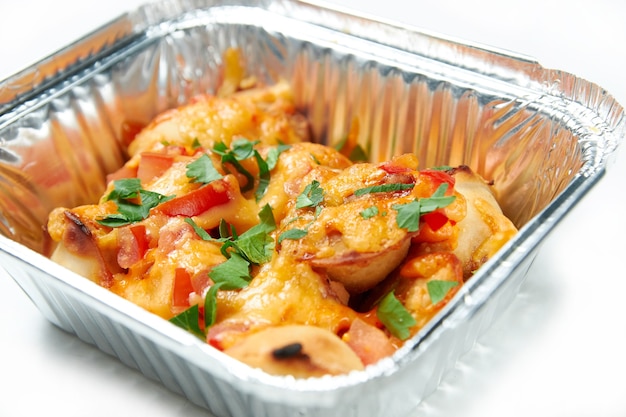 Baked dumplings in a packing container