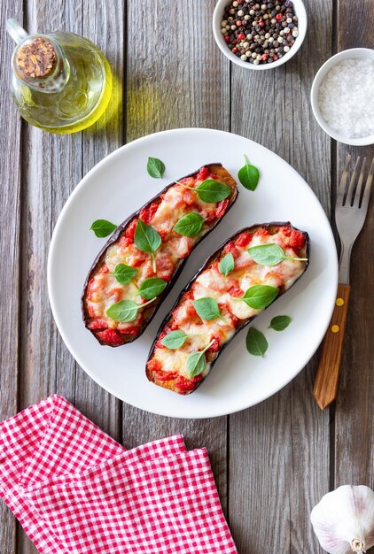 Baked eggplant with cheese mozzarella tomatoes and basil Healthy eating Italian food Parmigiana di melanzane