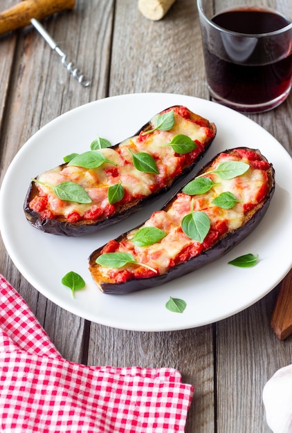 Baked eggplant with cheese mozzarella tomatoes and basil Healthy eating Italian food Parmigiana di melanzane