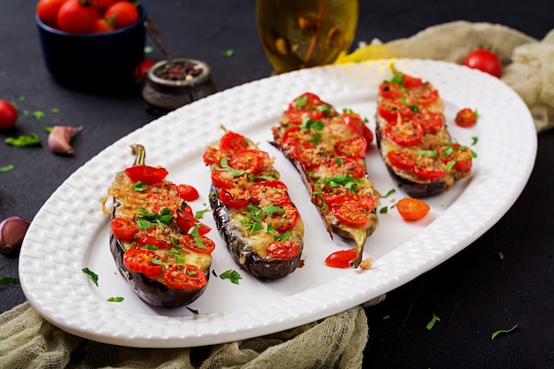 Baked eggplants with mozzarella and tomatoes with Italian herbs. 