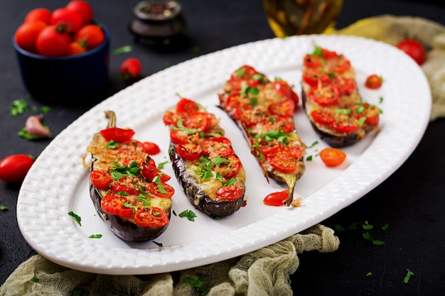 Baked eggplants with mozzarella and tomatoes with Italian herbs