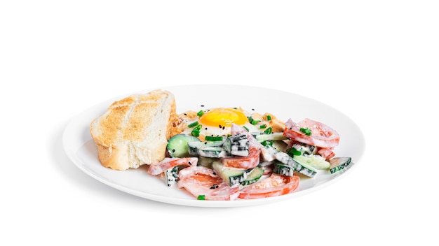 Baked eggs with parmesan and bacon isolated. Vegetables salad. Cloud eggs. Healthy breakfast.