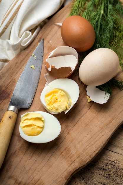 Baked eggs on wooden background