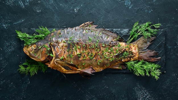 Baked Fish Carp with Vegetables Top view Free space for your text Rustic style