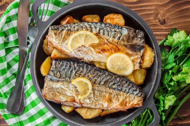 Baked fish mackerel and potatoes. Selective focus.