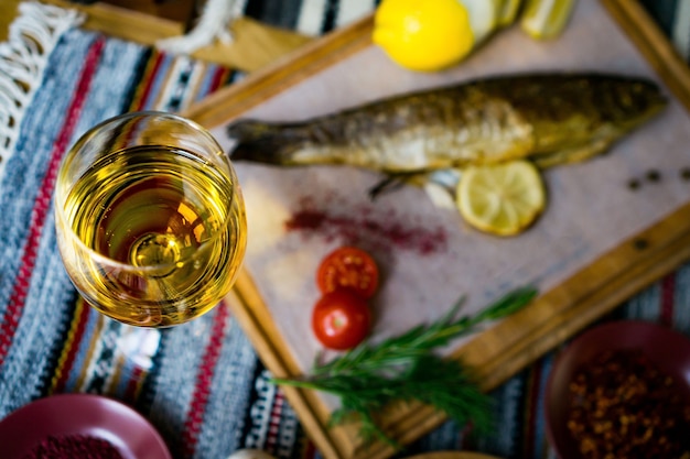 Baked fish seabass with fish spices, wine and salad. Baked seafood in restaurant Healthy eating