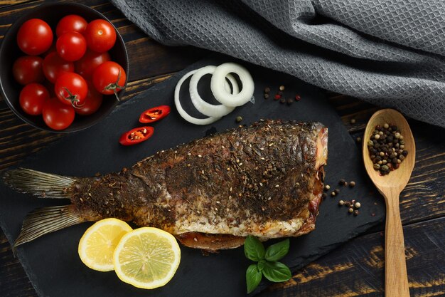 Baked fish on the table Baked carp served fried carp