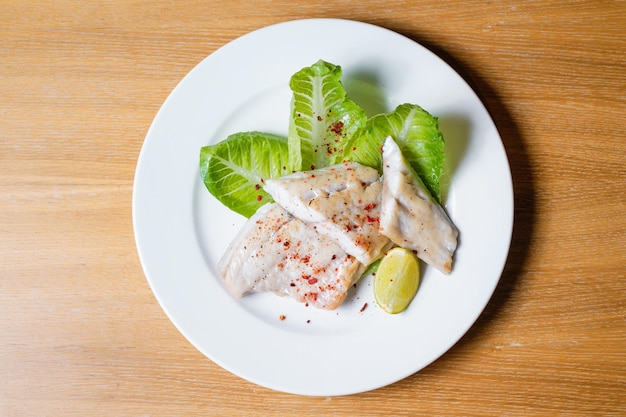 Baked fish with herbs and lemon