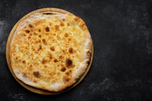 Baked georgian shoti bread on wooden board