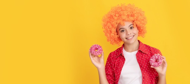 Baked goods sweet tooth childhood happiness yummy happy nice child hold donut Teenager child with sweets poster banner header copy space