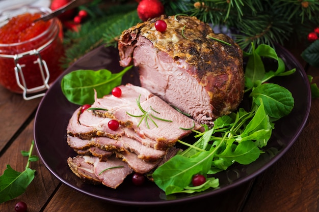 baked ham and red caviar, served on the old wooden table.